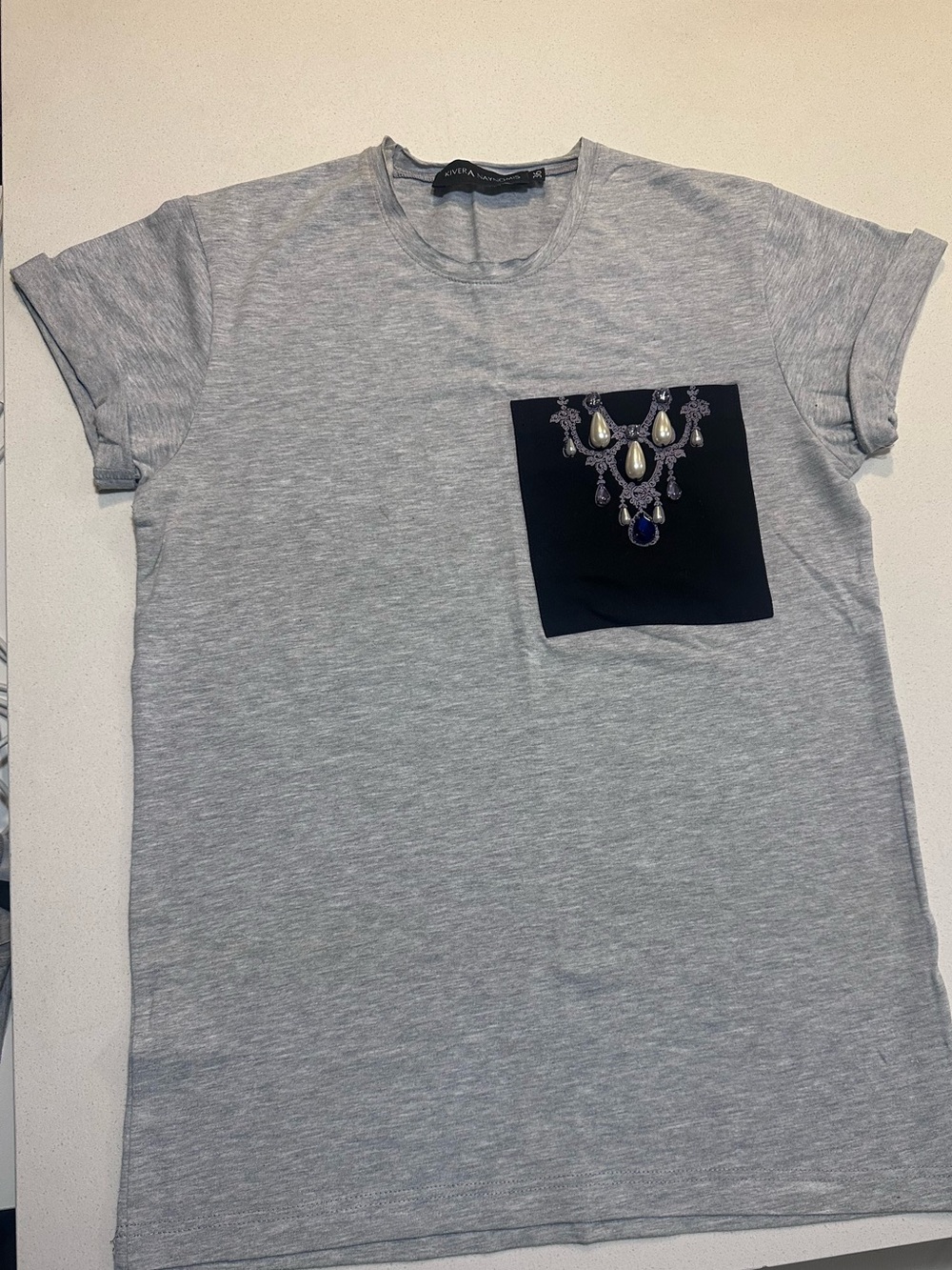 Light Gray Women's Tee with Embellished Black Pocket